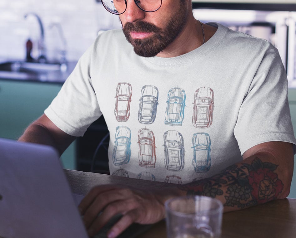 mockup-of-a-man-wearing-a-t-shirt-working-on-his-laptop-a20404