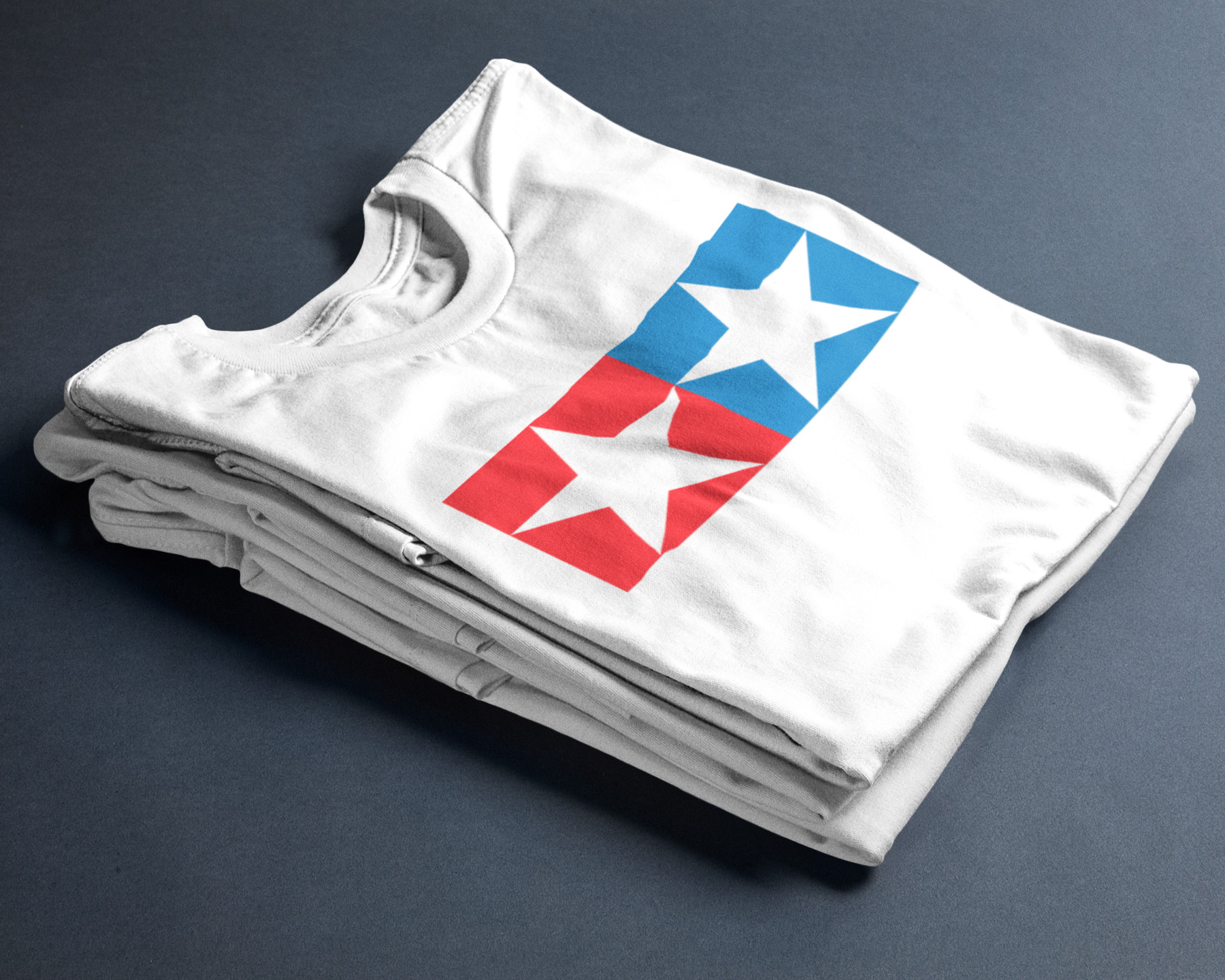 t-shirt-mockup-folded-over-two-tees-on-a-table-a17241